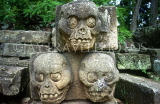 HONDURAS, Copan, Copan Ruins Archaeological Park, Mayan stone figures of sculls, HON137JPL