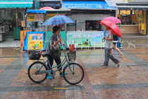 HONG KONG, Cheung Chau island, cyclist in the rain, HK1537JPL