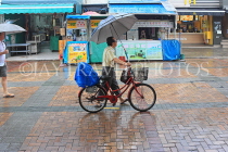 HONG KONG, Cheung Chau island, cyclist in the rain, HK1538JPL