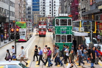HONG KONG, Hong Kong Island, Des Voeux Road, people crossing road, and trams, HK2053JPL