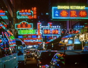 HONG KONG, Kowloon, Tsim Sha Tsui, neon lit night street and traffic, HK217JPL