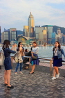 HONG KONG, Kowloon, Tsim Sha Tsui Promenade, people taking photo with HK skyline, HK1263JPL