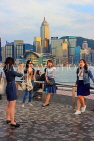 HONG KONG, Kowloon, Tsim Sha Tsui Promenade, people taking photo with HK skyline, HK1263JPL