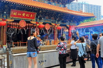 HONG KONG, Kowloon, Wong Tai Sin Temple, Main Altar, worshippers, incense sticks, HK1132PL