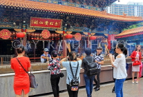 HONG KONG, Kowloon, Wong Tai Sin Temple, Main Altar, worshippers, incense sticks, HK1133PL