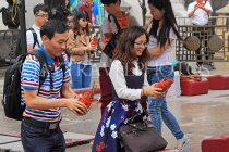 HONG KONG, Kowloon, Wong Tai Sin Temple, worshippers shaking Fortune Sticks, HK1157JPL