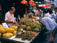 HONG KONG, Kowloon, market scene, customer sniffing Durian fruit, HK280JPL