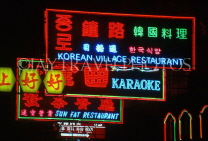 HONG KONG, Kowloon, neon lit shop signs, HK357JPL