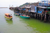 HONG KONG, Lantau Island, Tai O fishing village, stilt houses, fishing boats and tour boat, HK730JPL