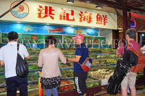 HONG KONG, Sai Kung, waterfront, seafood restaurants, diners checking the live seafood, HK1420JPL