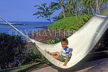 Hawaiian Islands, HAWAII (Big Island), Hilton Waikoloa Village, boy in hammock, HAW264JPL