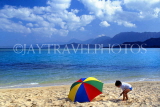 Hawaiian Islands, OAHU, Kualoa Ranch Island, boy playing on beach, HAW129JPL