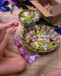 Hawaiian Islands, OAHU, Lei making with fresh Spary Orchids, HAW1112JPL
