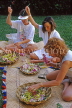 Hawaiian Islands, OAHU, tourists learning to make Leis with fresh Spary Orchids, HAW228JPL