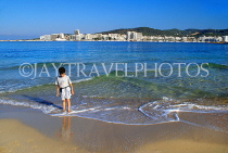 IBIZA, beach and seascape, West Coast, boy paddling, San Antonio in background, SPN1408JPL