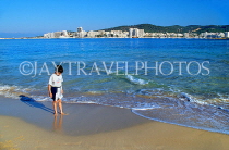 IBIZA, beach and seascape, West Coast, boy paddling, San Antonio in background, SPN1411JPL