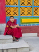 INDIA, Sikkim, Phodong Monastery, young monk sitting on steps, IND1350JPL