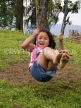 INDIA, Sikkim, Sikkimese girl on a swing, IND1360JPL
