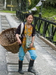 INDIA, Sikkim, girl with her basket on a bridge, IND1480JPL