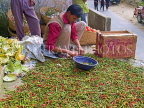 INDIA, Sikkim, roadside food stall, vendor with chillies,  IND1355JPL