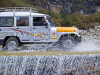 INDIA, Sikkim, tourist jeep crossing a river in northern Sikkim, IND1362JPL