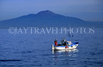 ITALY, Campania, Amalfi Coast, SORRENTO, fishing boat at sea and Mount Vesuvius, ITL1043JPL