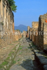 ITALY, Campania, POMPEII, ancient stone paved street, Mt Vesuvius in background, ITL1066JPL