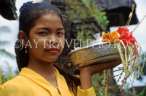 Indonesia, BALI, village girl at temple, with flower offerings, BAL1320JPL