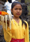 Indonesia, BALI, village girl at temple, with flower offerings, BAL544JPL