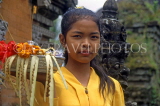 Indonesia, BALI, village girl at temple, with flower offerings, BAL761JPL