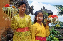 Indonesia, BALI, village girls carrying offerings (at temple), BAL766JPL