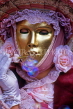 Italy, VENICE, Carnival, masquerade character, woman in pink, blowing bubbles, ITL1802JPL