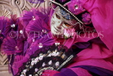 Italy, VENICE, Carnival, masquerade character in pink and magenta, ITL1618JPL