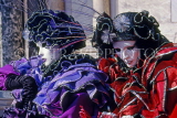 Italy, VENICE, Carnival, masquerade characters, couple in red and purple ruffles, ITL1794JPL