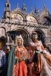Italy, VENICE, Carnival, two masquerade characters by St Peters Basilica, ITL560JPL