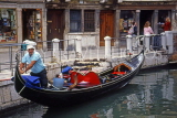 Italy, VENICE, canal scene, gondolier in his boat, ITL1816JPL