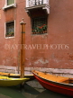 Italy, VENICE, canal scene with boats and flower pots on window, ITL772JPL