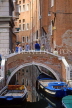 Italy, VENICE, small bridge over narrow canal, moored boats, ITL1850JPL