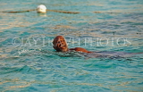 JAMAICA, Montego Bay, Jamaican man enjoying his swim, JM333JPL
