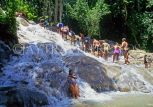 JAMAICA, Ocho Rios, Dunn's River Falls, tourists climbing upstream, JM214JPL