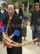LAOS, Luang Prabang, Hmong man and traditional instrument at Songkran New Year festival, LAO52JPL