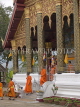 LAOS, Luang Prabang, monks filing out of temple in UNESCO World Heritage Site, LAO56JPL