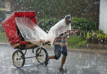 MADAGASCAR, Antisirabe, pousse pousse (rickshaw) and driver in the rain, MDG215JPL