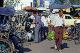 MALAYSIA, Kota Bharu, street scene, tricycle rickshaws and man carrying Bananas, MSA658JPL