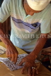 MALAYSIA, Kota Bharu, traditional sports, Kite making, man cutting stencil, MSA700JPL