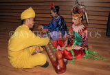 MALAYSIA, Kuala Lumpur, cultural show, people in traditional dress, playing Congkak, MSA776JPL