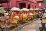 MALAYSIA, Melacca, decorated tricycle rickshaws along roadside, MSA705JPL