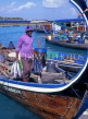 MALDIVE ISLANDS, Male, fisherman unloading Tuna from dhoni (fishing boat), MAL563JPL