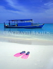 MALDIVE ISLANDS, beach with pair of flippers and Dhoni (fishing boat), MAL505JPL