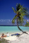 MALDIVE ISLANDS, beach with two tourists and coconut tree, MAL678JPL